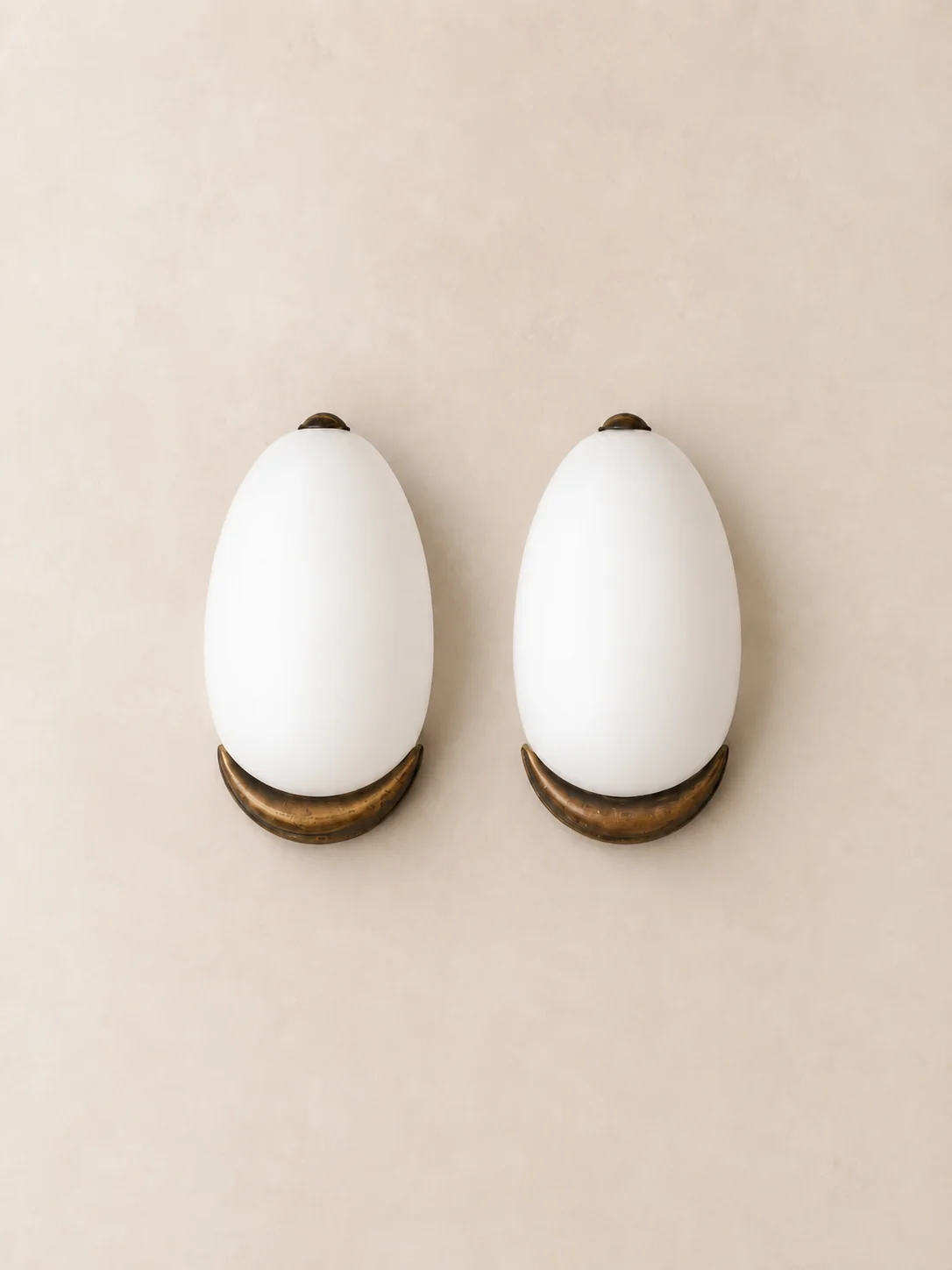 Italian opaline glass and brass wall sconces.