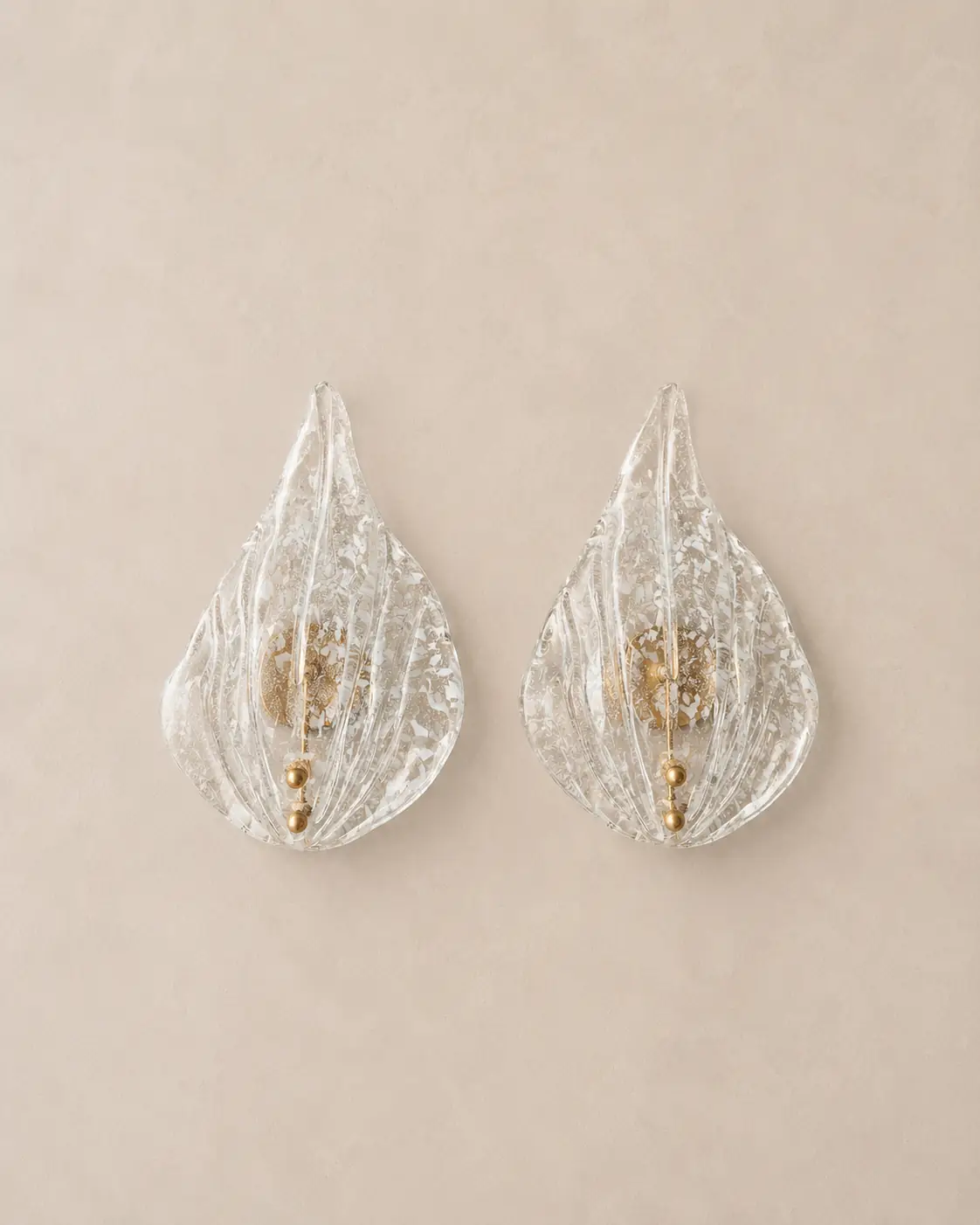 Vintage white flake Murano glass wall sconces with brass details.