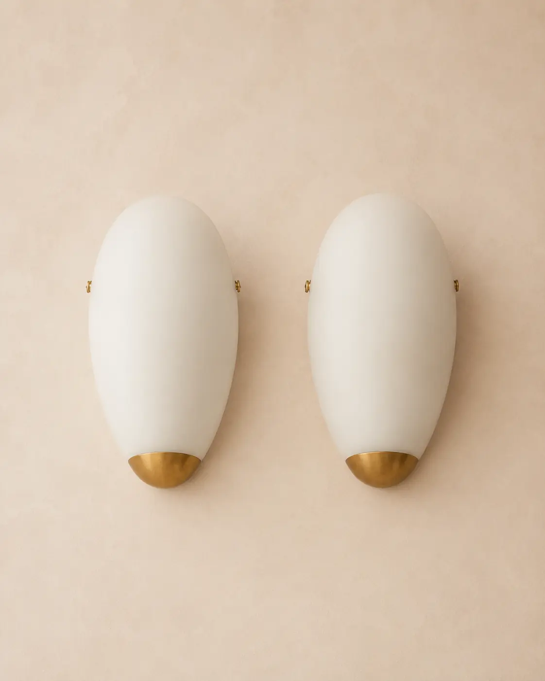 Round milk glass wall sconces.