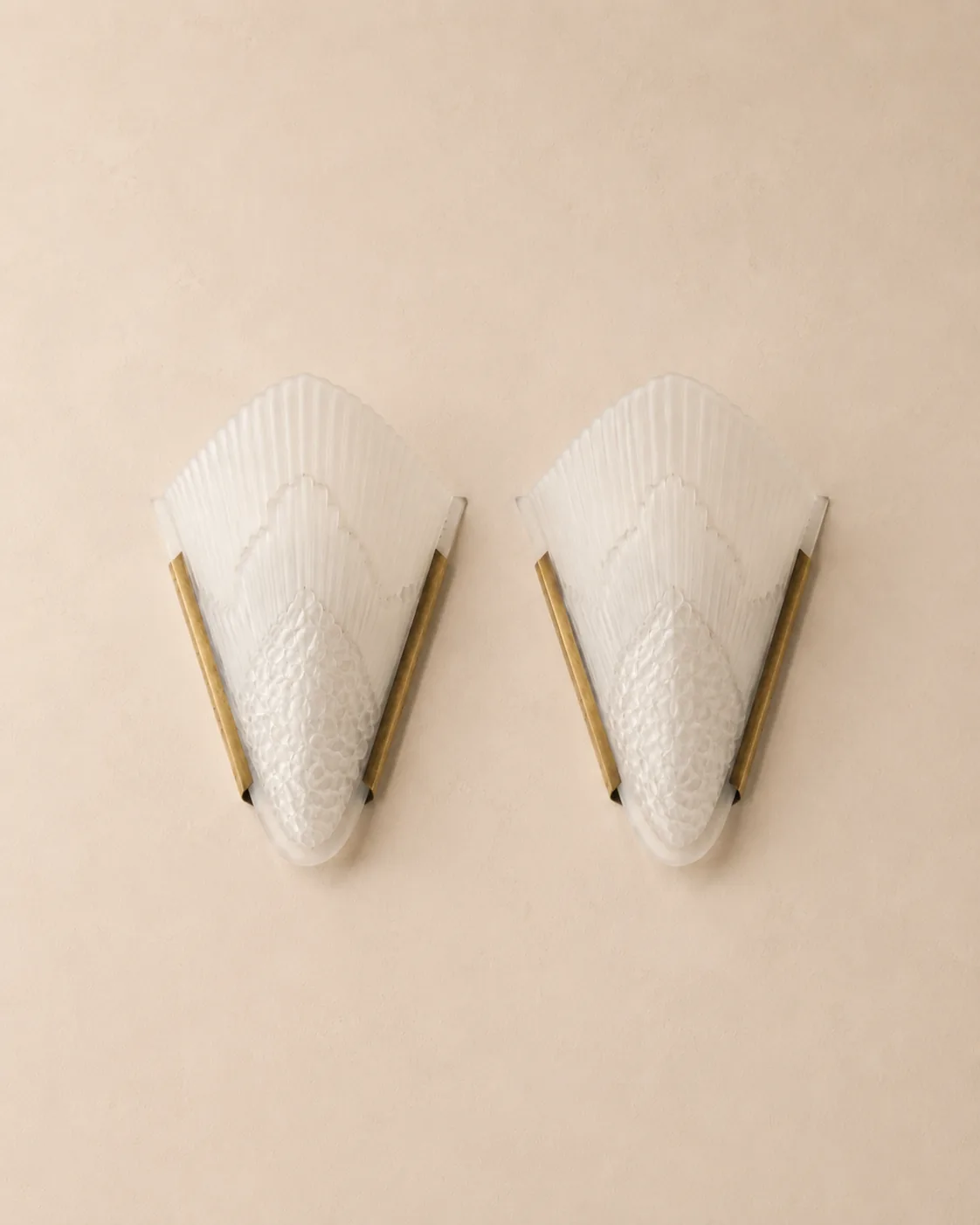 French Art Deco brass and frosted glass wall sconces.